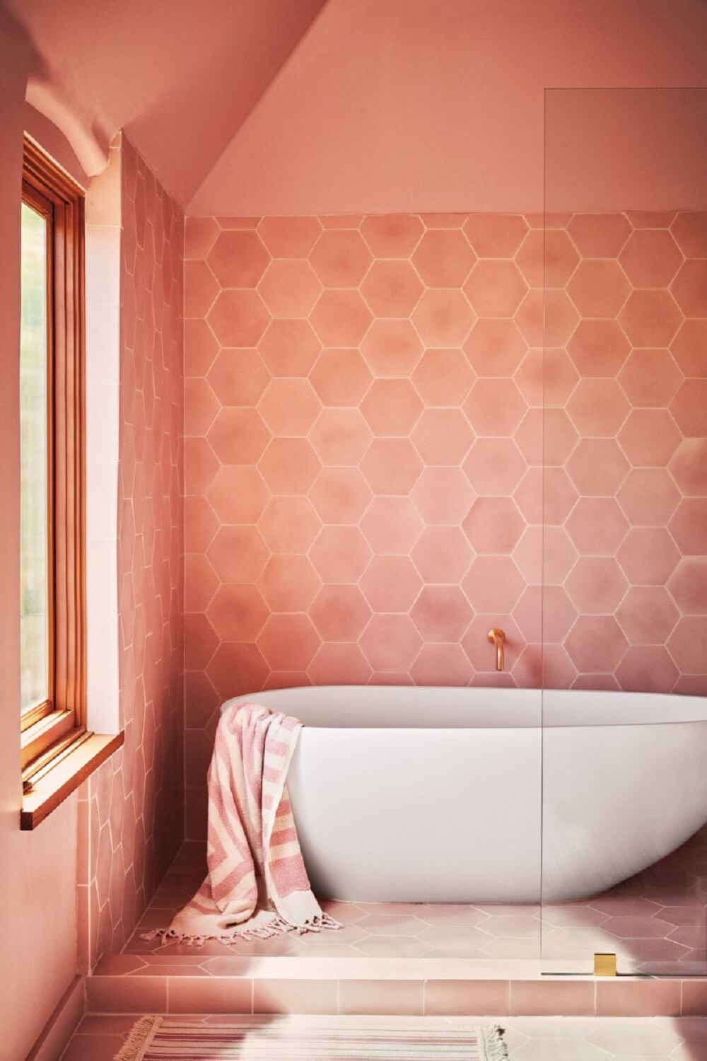 bathroom freestanding bath coral pink tiles and walls