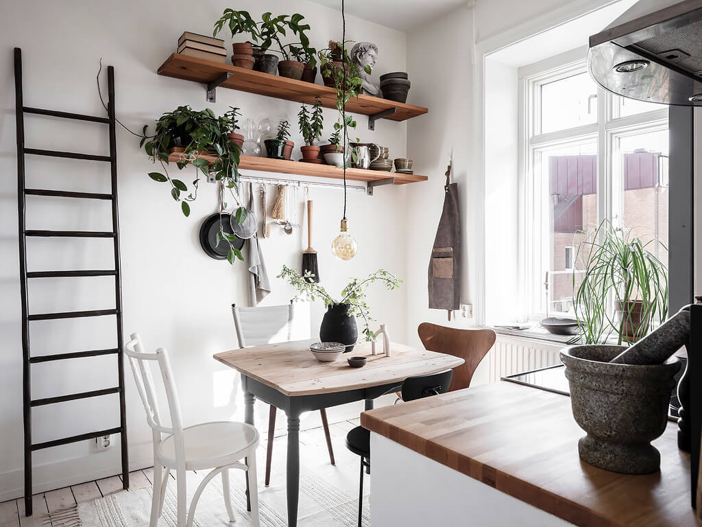 small blue scandinavian apartment nordroom9 A Charming Swedish Apartment with Blue Walls and Plants