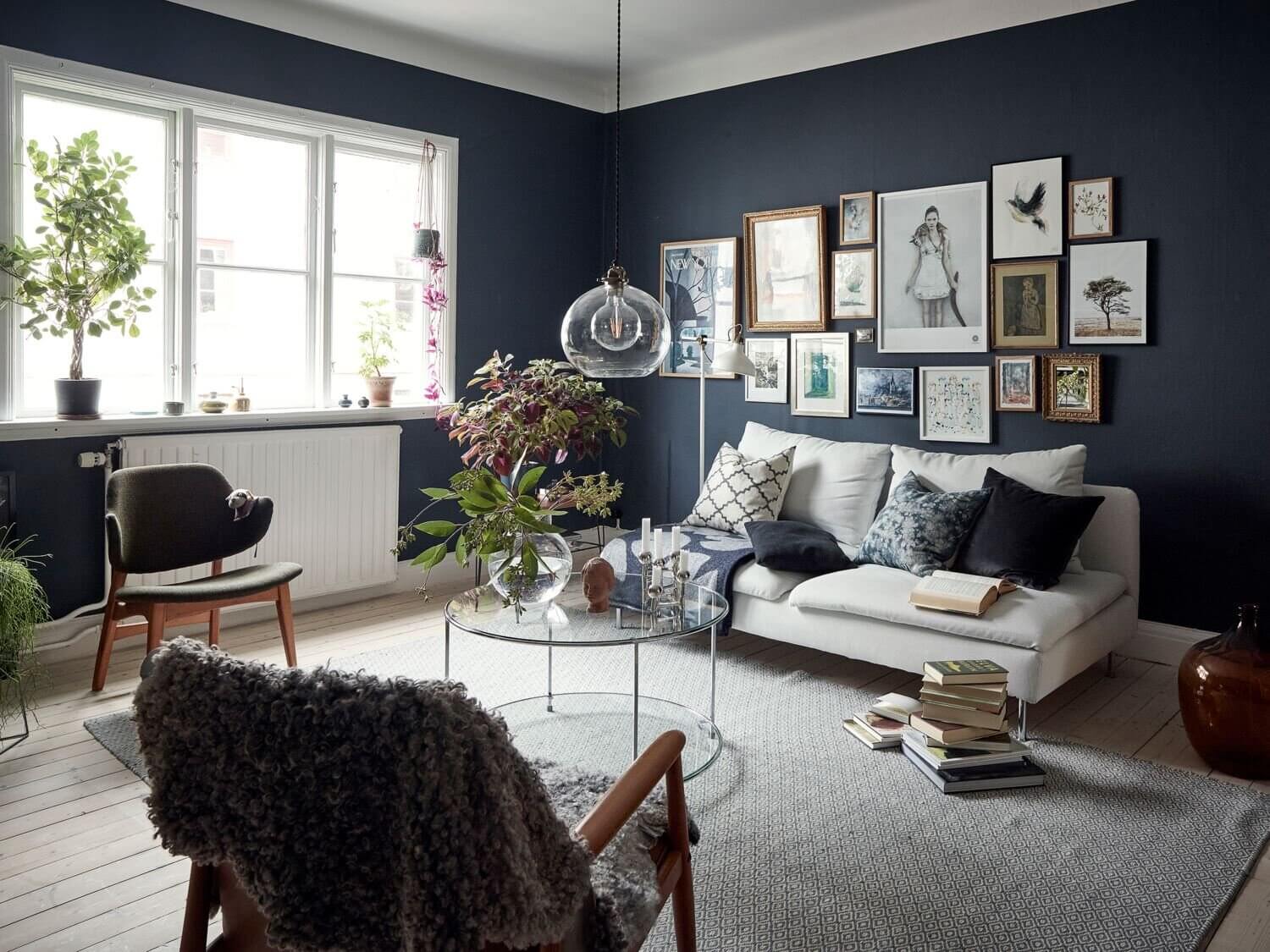 A Cozy Apartment With A Deep Blue Living Room