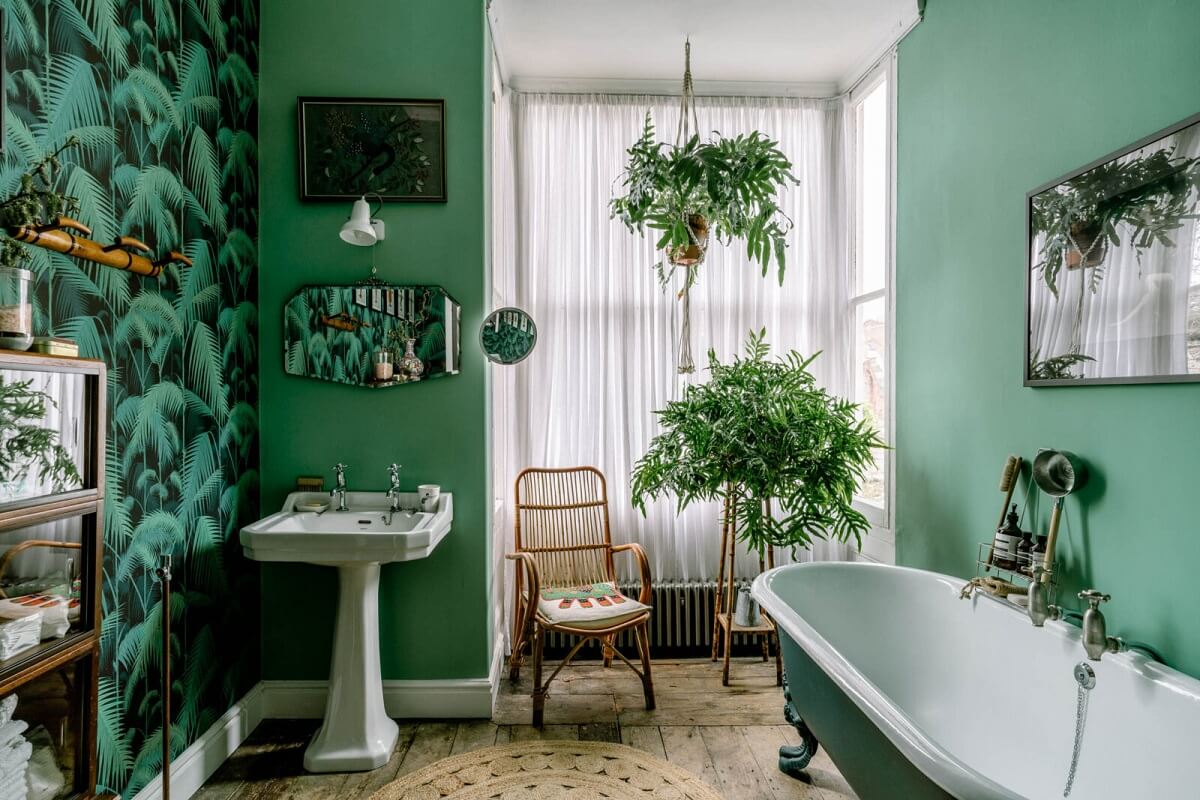 green bathroom with plants wooden floor and wallpaper nordroom