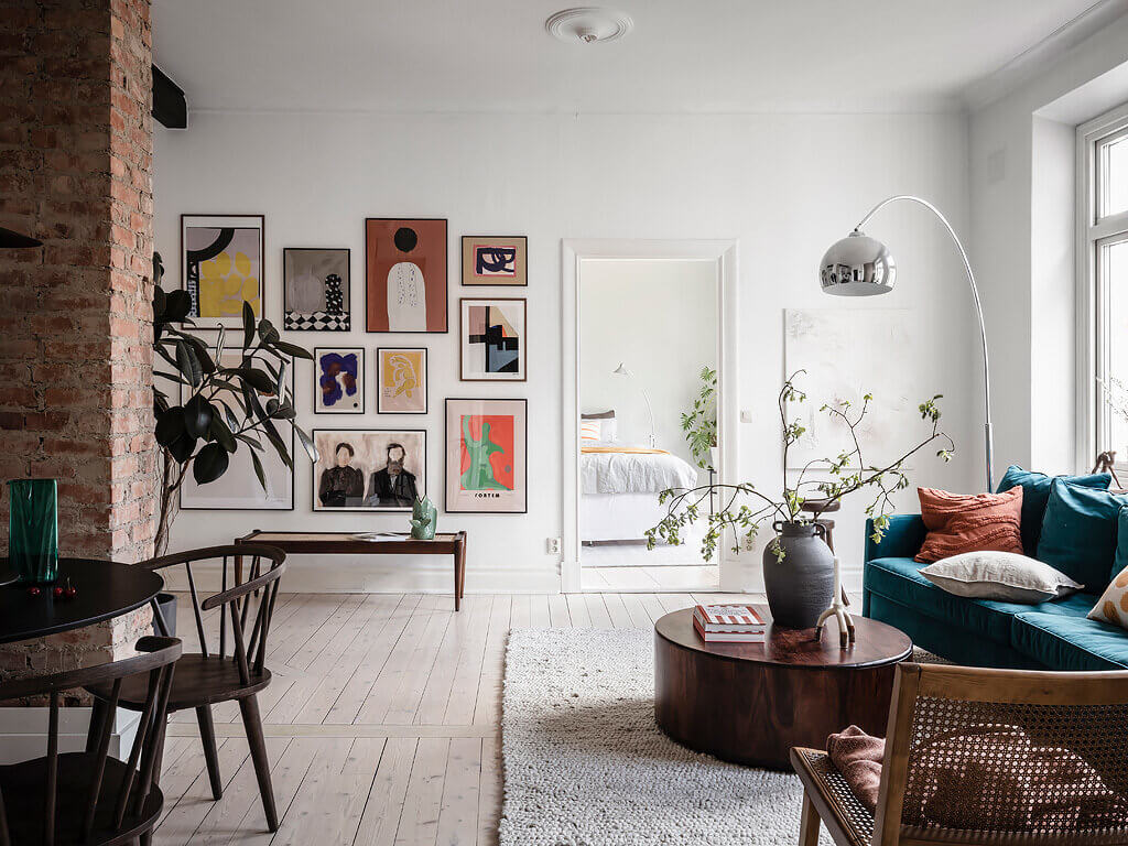 A Scandinavian Apartment with Exposed Brick Wall and Colorful Touches