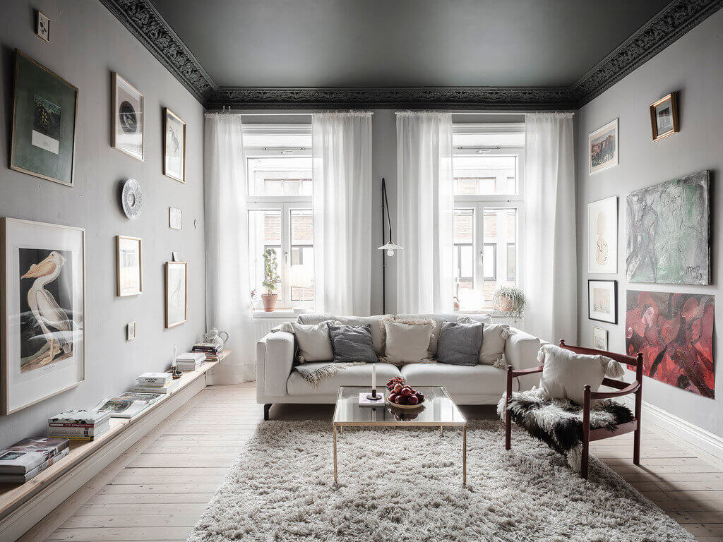 A Dark Green Painted Ceiling In An Art-Filled Apartment