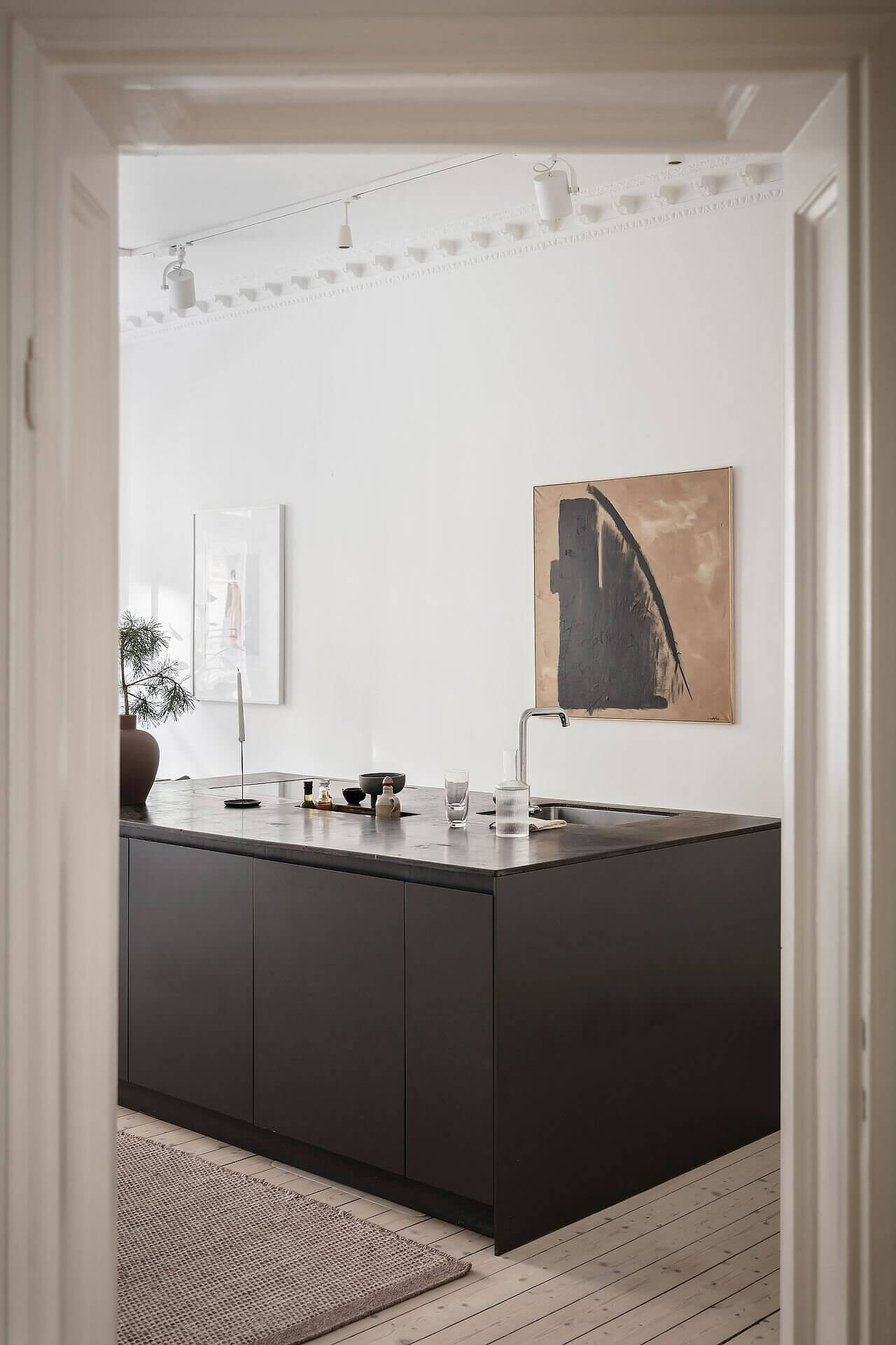 white scandinavian apartment grey kitchen nordroom10 A White Scandinavian Apartment With A Sleek Dark Grey Kitchen