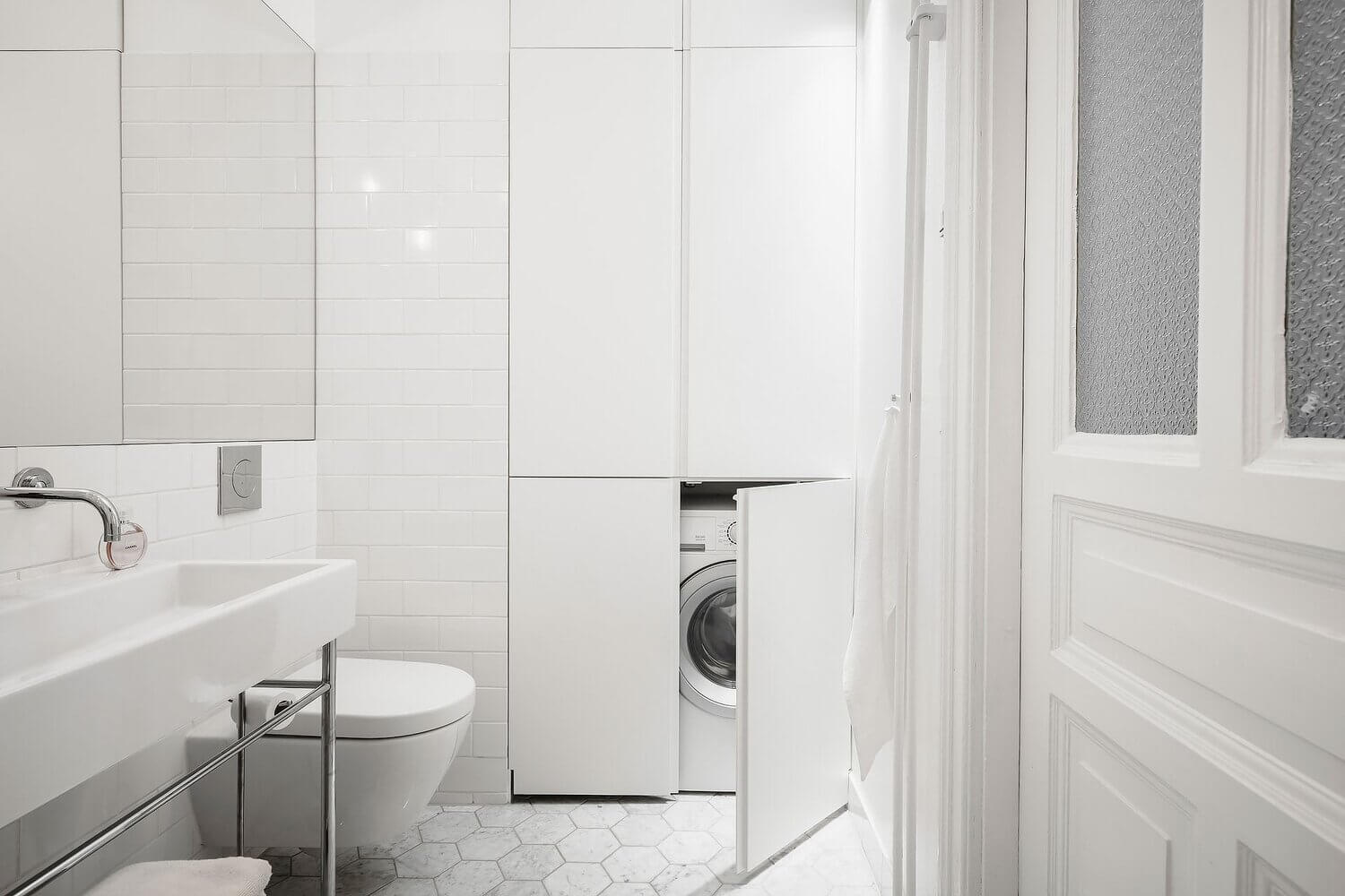 white scandinavian apartment grey kitchen nordroom20 A White Scandinavian Apartment With A Sleek Dark Grey Kitchen