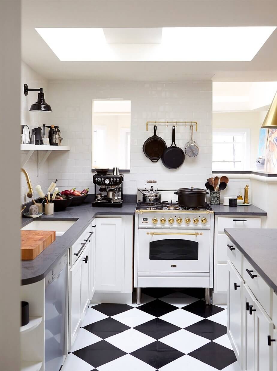white-kitchen-cabinets-checkerboard-floor-skylight