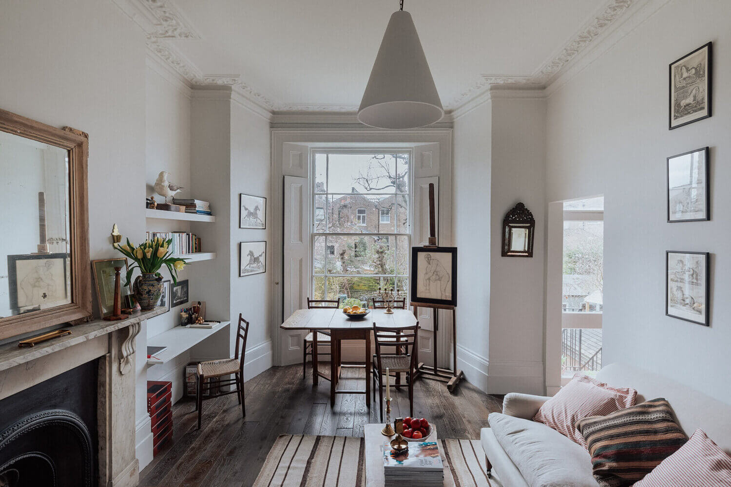 DarkwoodenfloorandfireplaceatTheSmallLondonApartmentOfAnAntiquesDealer TheNordroom1 The Small London Apartment Of An Antiques Dealer