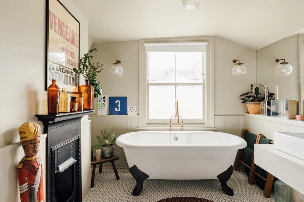 bathroom clawfoot bath fireplace nordroom A Colorful Family Home in London