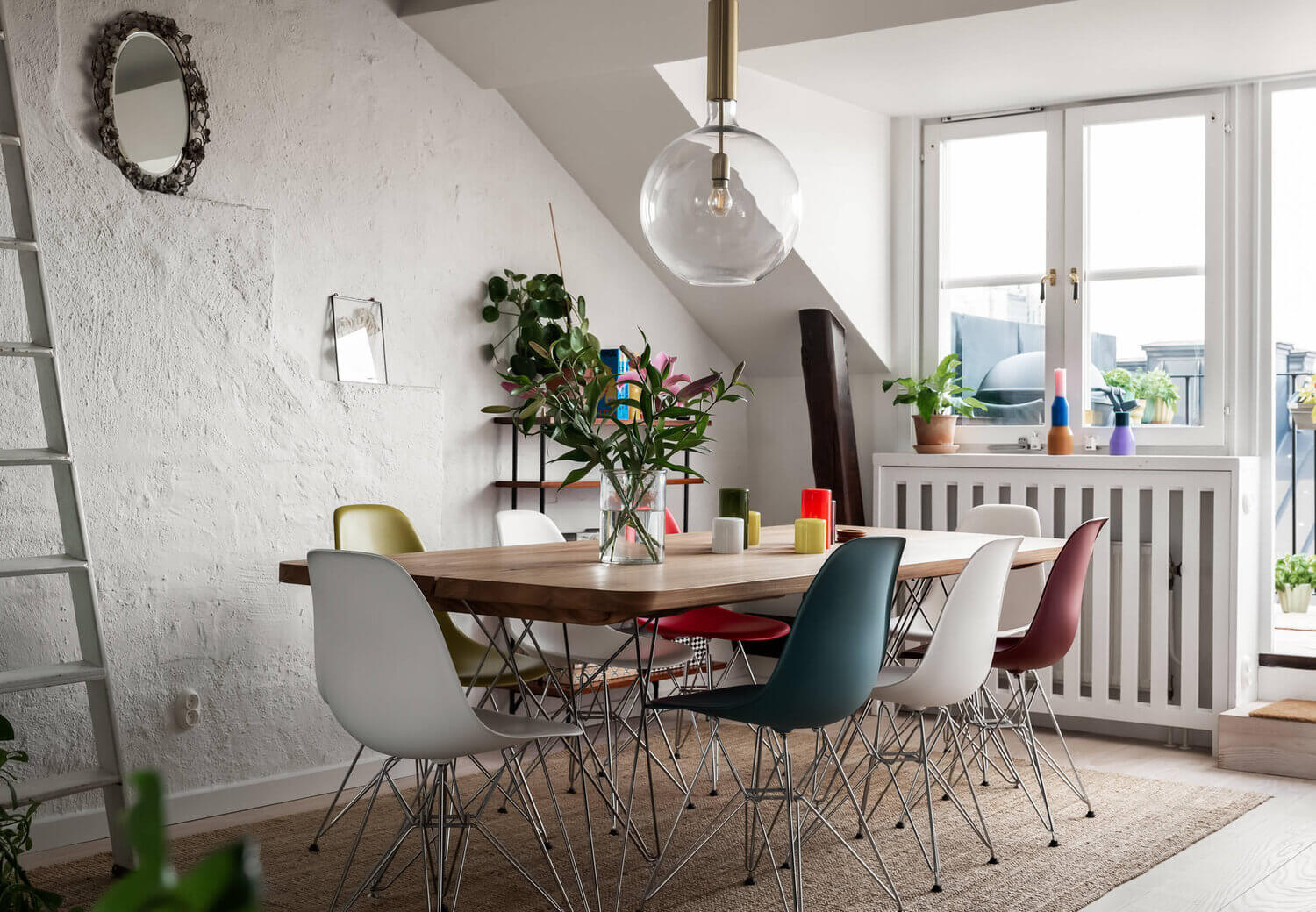 colorful eames dining chair penthouse nordroom A Scandinavian Penthouse Apartment With A Dark Green Kitchen