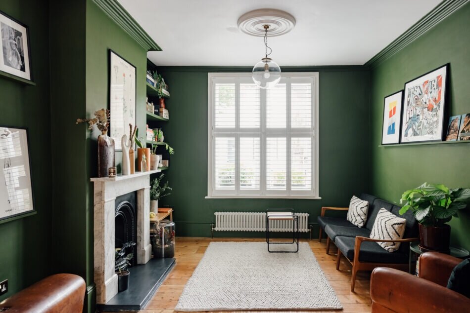 A Colorful Family Home in London 1 green-living-room-marble-fireplace-nordroom