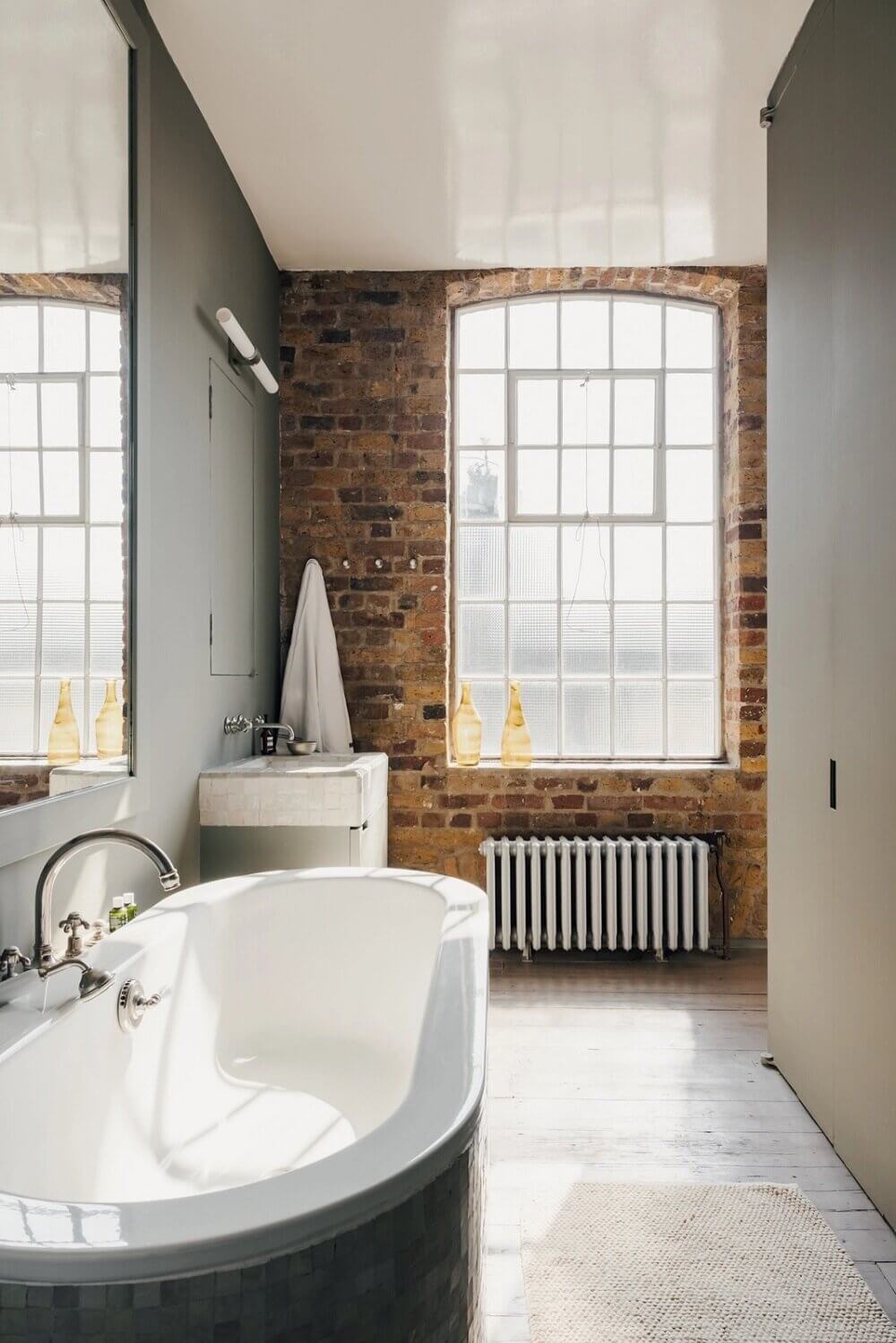 london-loft-ilse-crawford-vincent-van-duysen-grey-bookshelves-kitchen-island--zellige-tiles-brick-wall-victorian-warehouse-conversion-nordroom