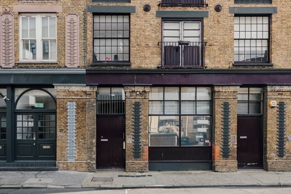 london-loft-ilse-crawford-vincent-van-duysen-grey-bookshelves-kitchen-island--zellige-tiles-brick-wall-victorian-warehouse-conversion-nordroom