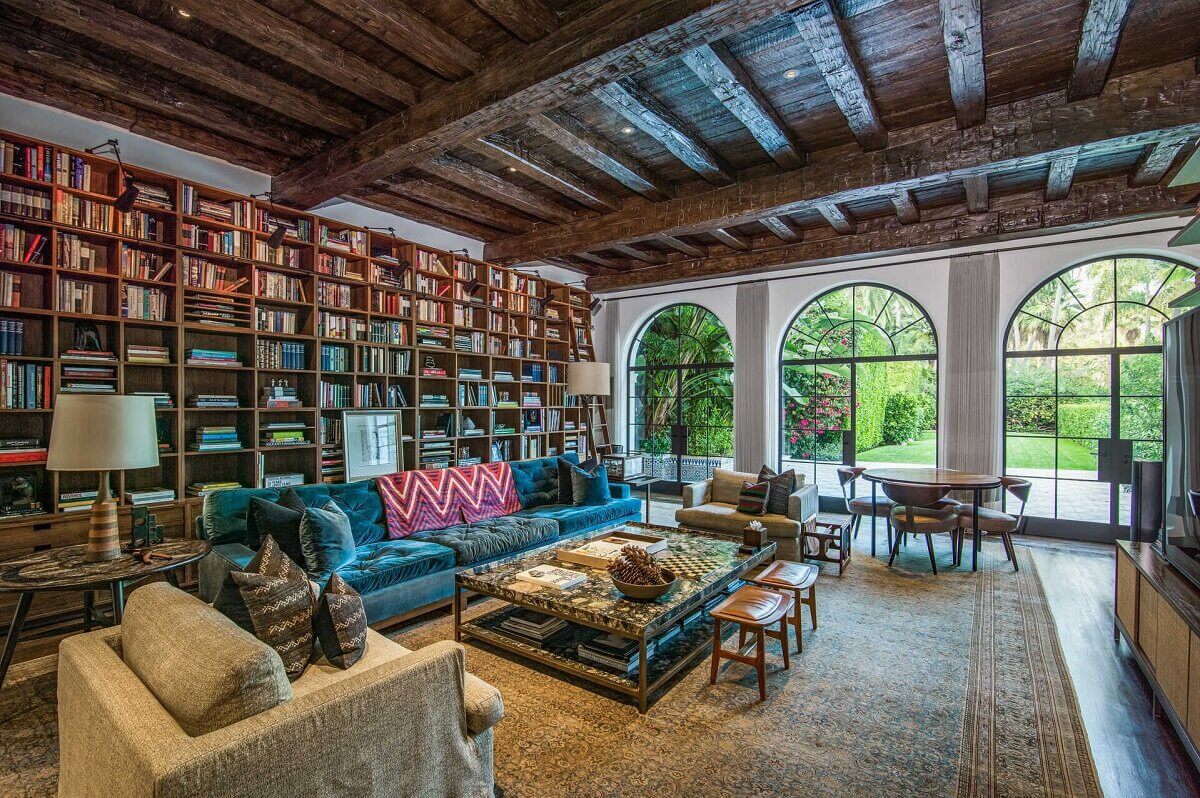 rustic living room bookshelves spanish ceiling santa monica nordroom A 1930s Mediterranean-Style Estate in Santa Monica