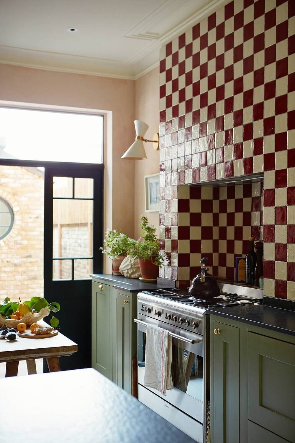 green-kitchen-cabinets-red-white-tiles-pink-walls-nordroom