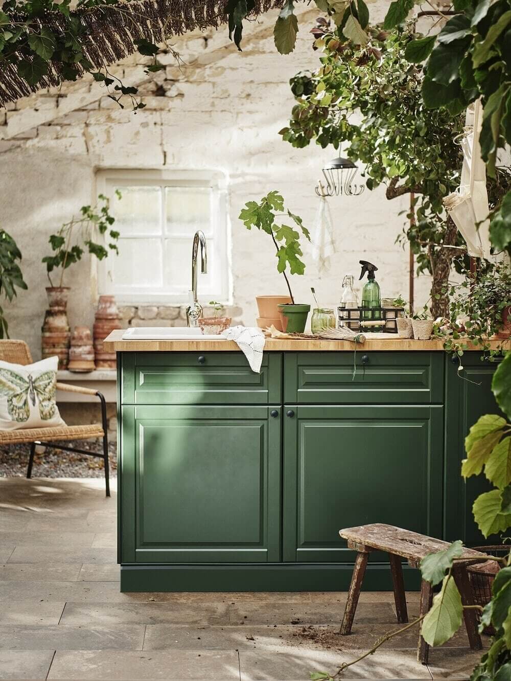 https://www.thenordroom.com/wp-content/uploads/2021/07/green-kitchen-island-ikea-plants-nordroom.jpg