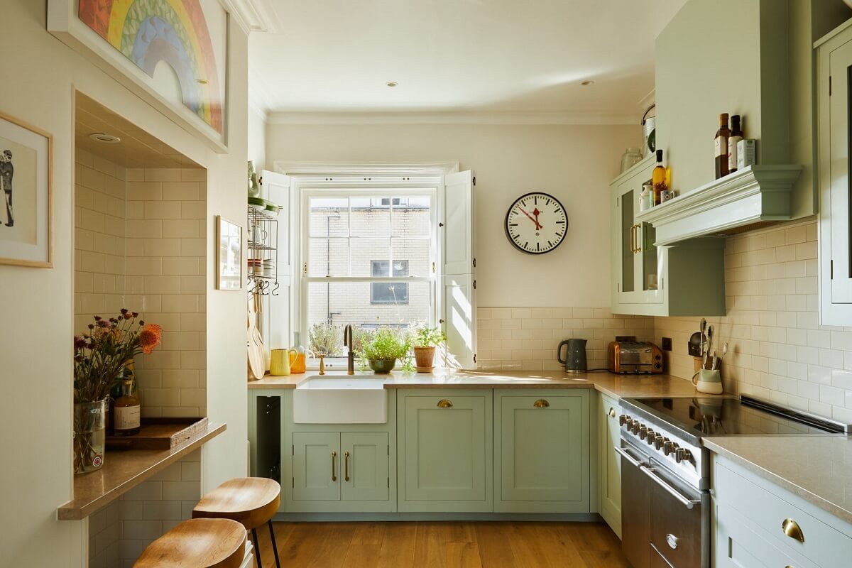 green kitchen with butler sink and bar seating nordroom