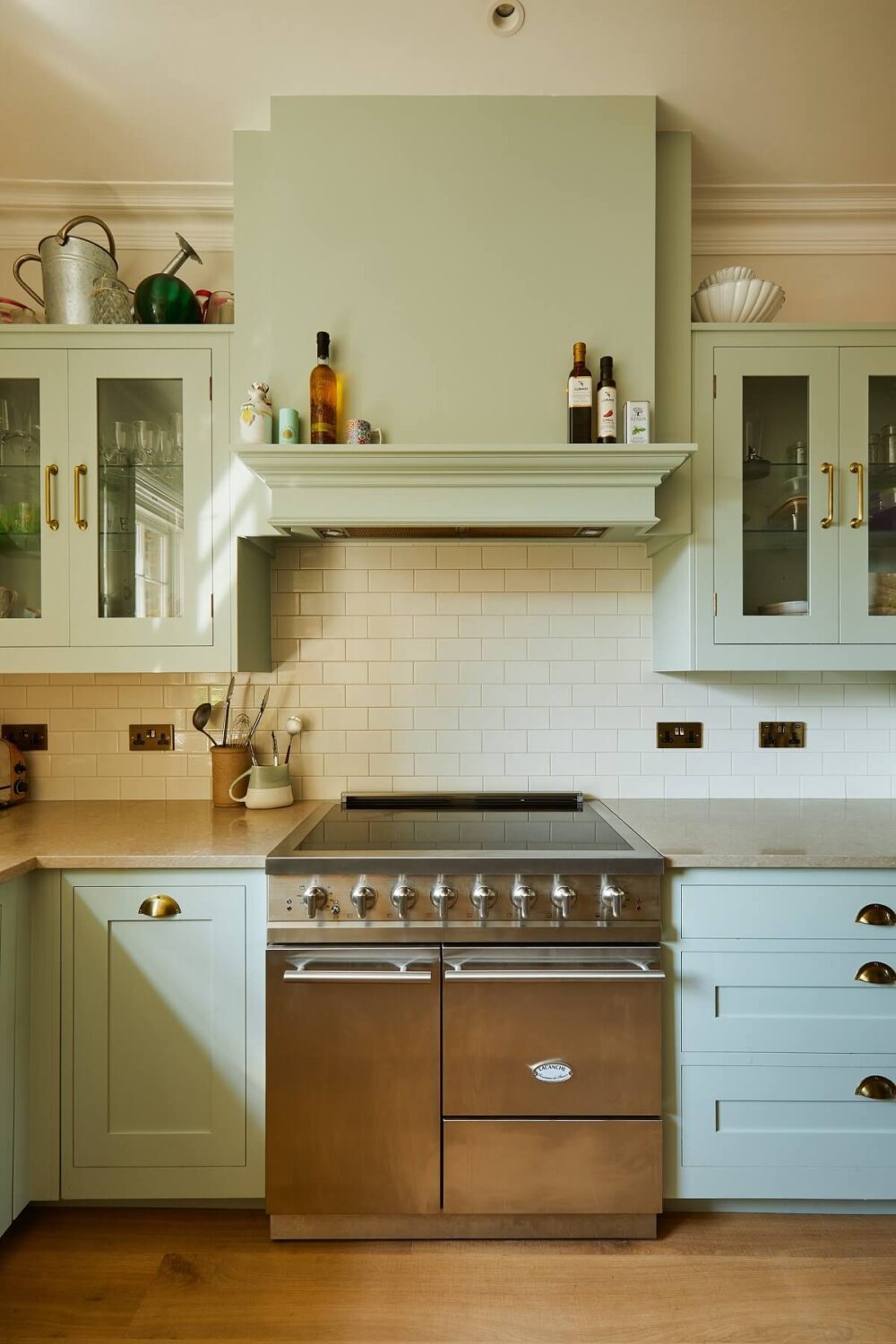 green kitchen with white tiles