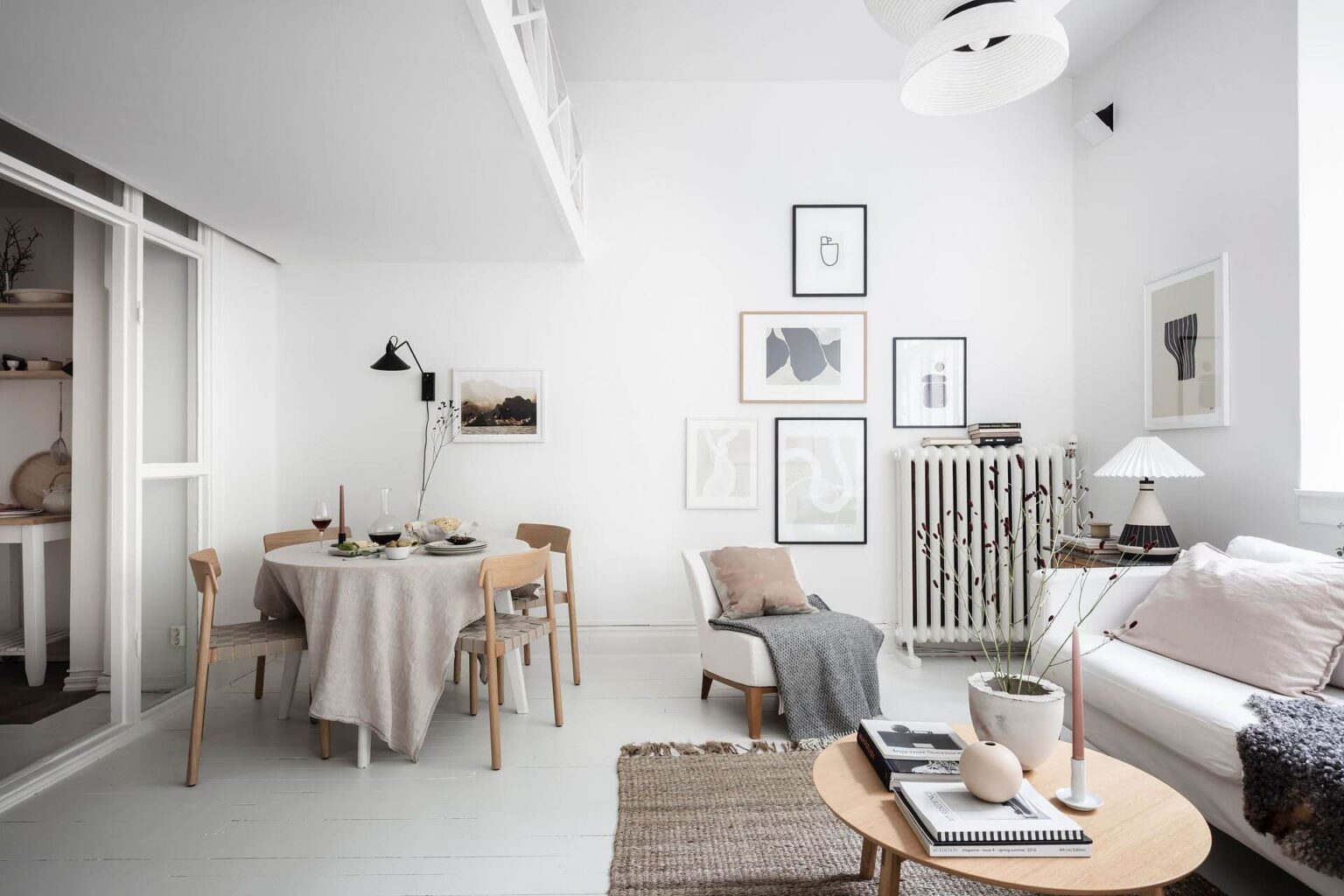 View of A White Scandinavian Studio Apartment With Loft Bed - The Nordroom