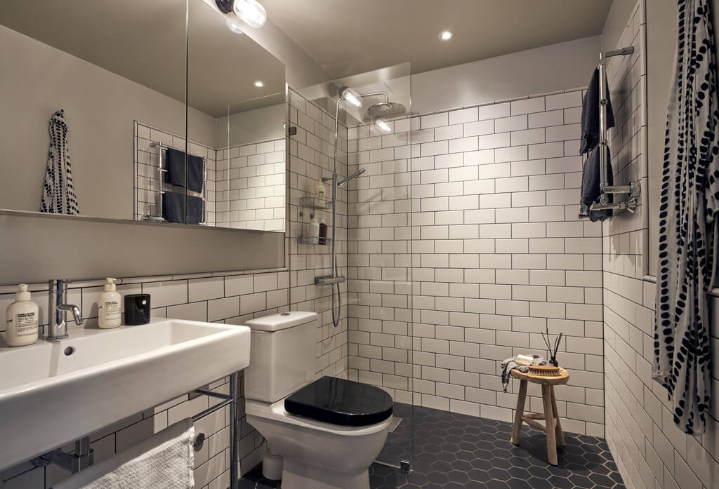 bathroom-black-hexagon-tiles-white-subway-tiles-walk-in-shower-nordroom