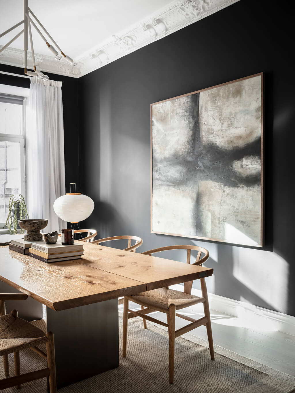 A Black Dining Room in a Stylish Apartment