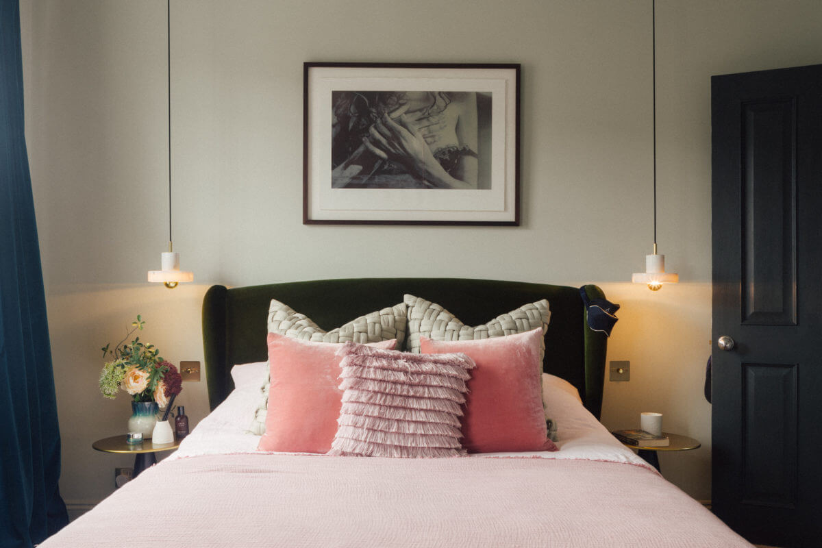 light-grey-bedroom-velvet-headboard-pink-bedding-nordroom