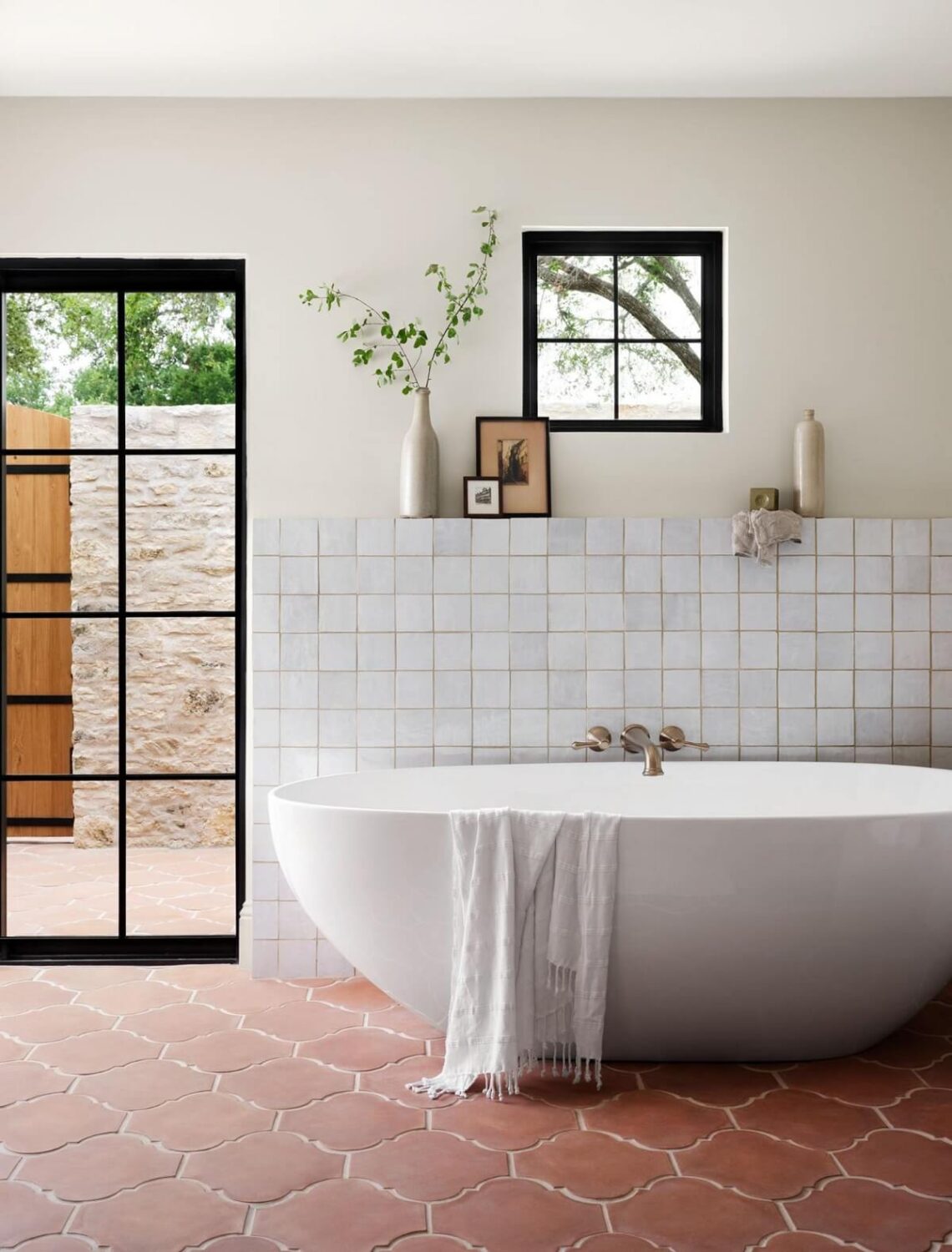 Terracotta tiles in a bathroom with white walls and fixtures