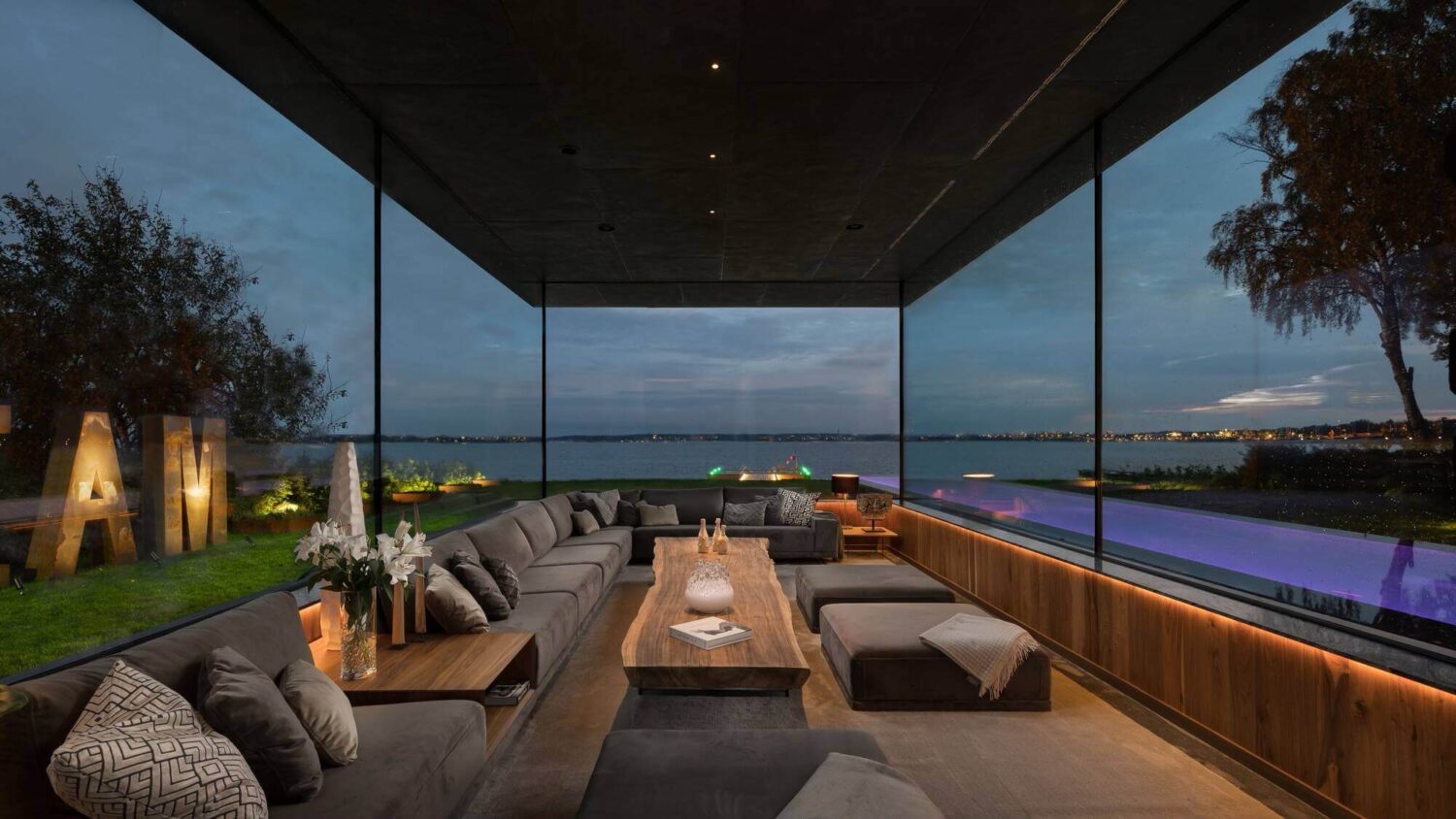 glass-modern-sitting-room-modern-architectural-villa-stockholm-sweden-nordroom