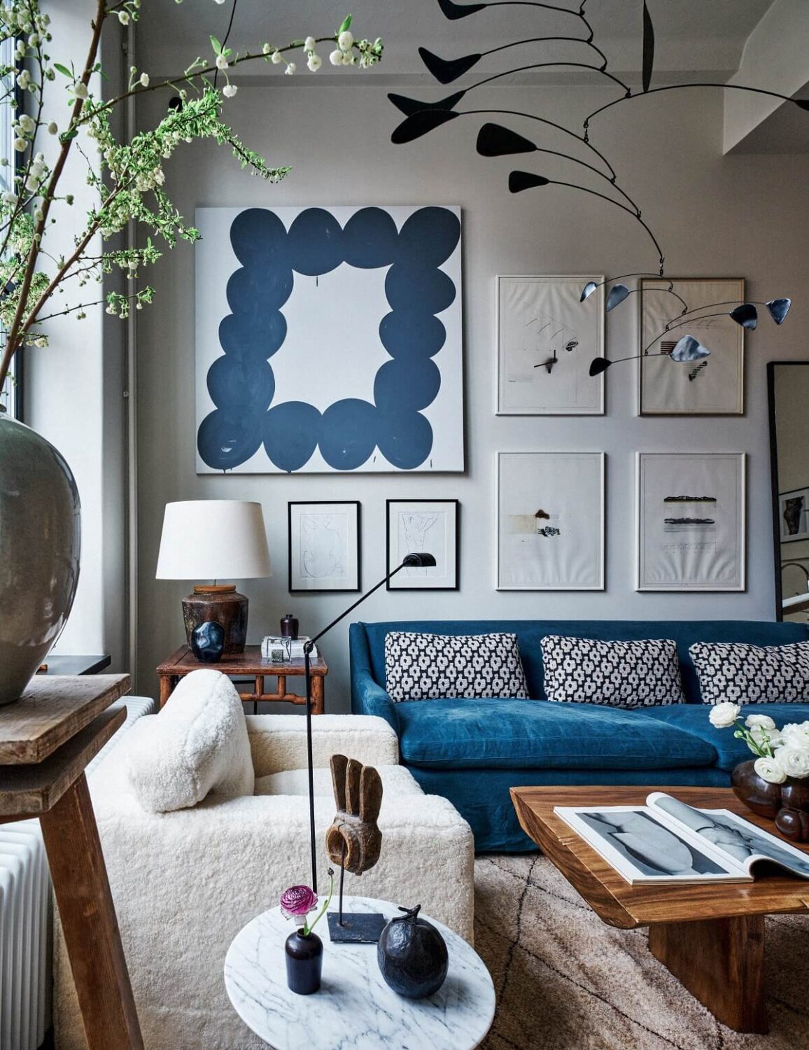 living-room-high-ceilings-art-blue-sofa-scandinavian-design-nordroom