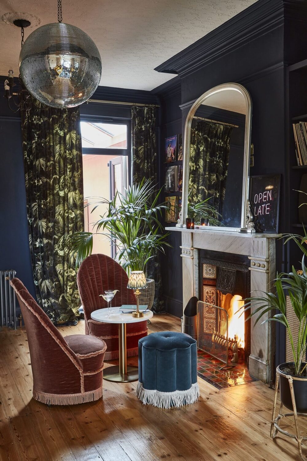 moody-blue-sitting-room-velvet-chairs-fireplace-nordroom