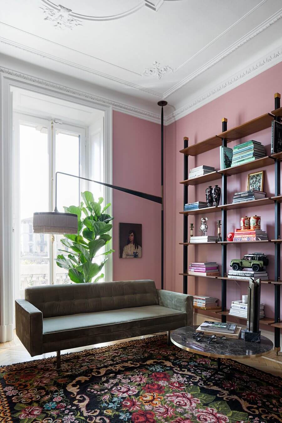 pink-living-room-colorful-rug-bookshelves-nordroom