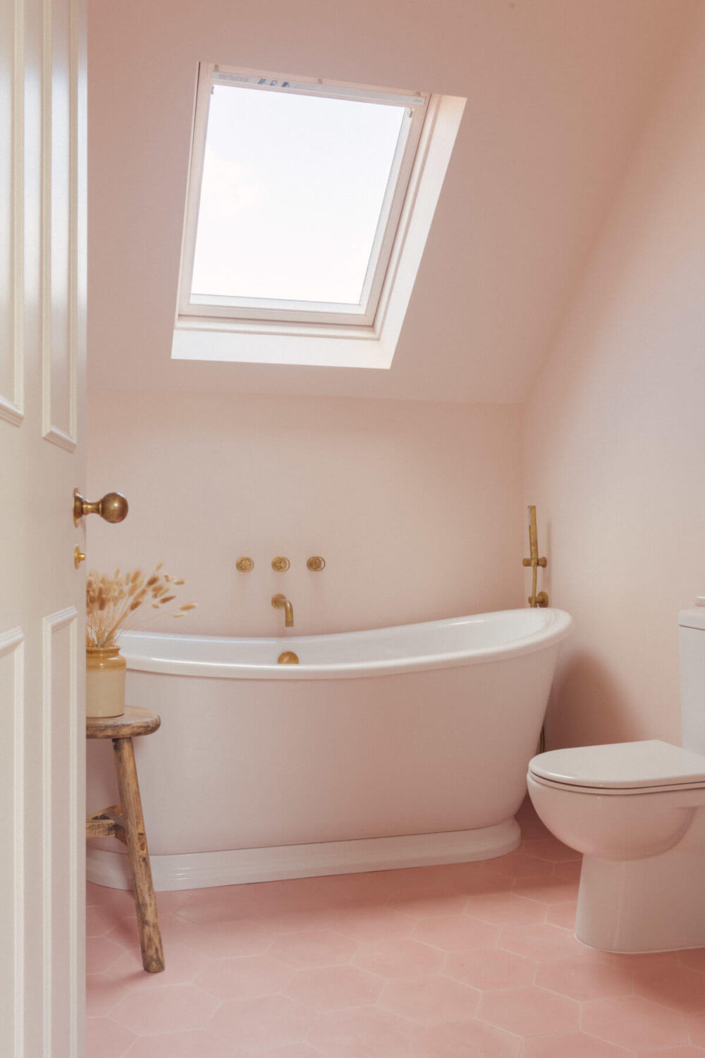 attic-bathroom-freestanding-bath-pink-floor-tiles-family-home-london-nordroom