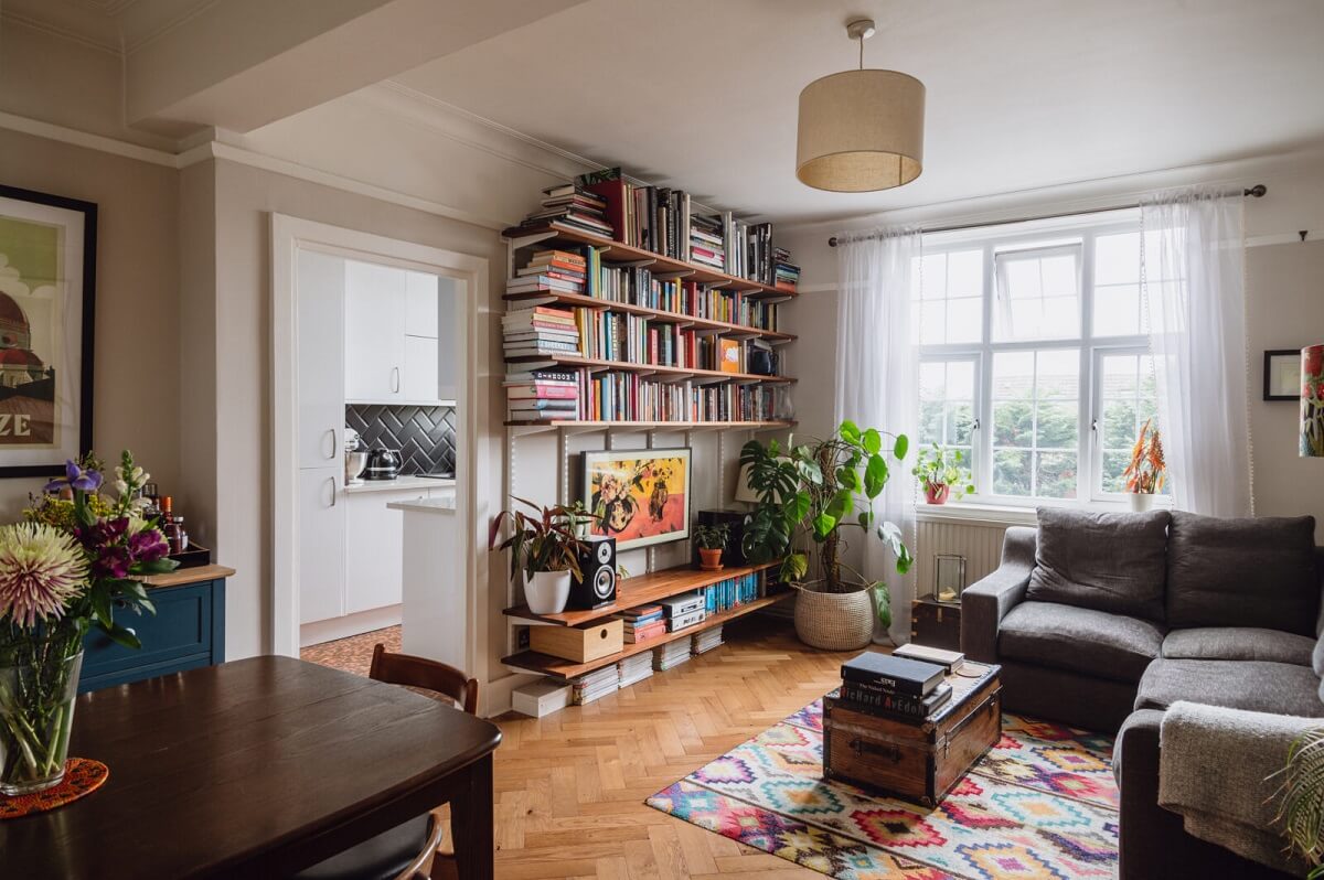A Charming Two Bedroom Apartment in London 1 charming-living-room-bookshelves-colorful-rug-nordroom