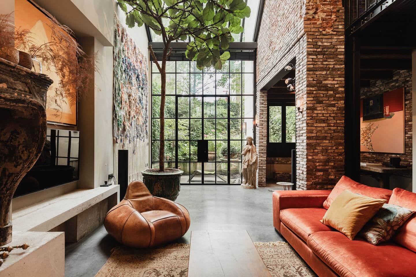 double-height-living-room-exposed-brick-industrial-glass-doors-nordroom