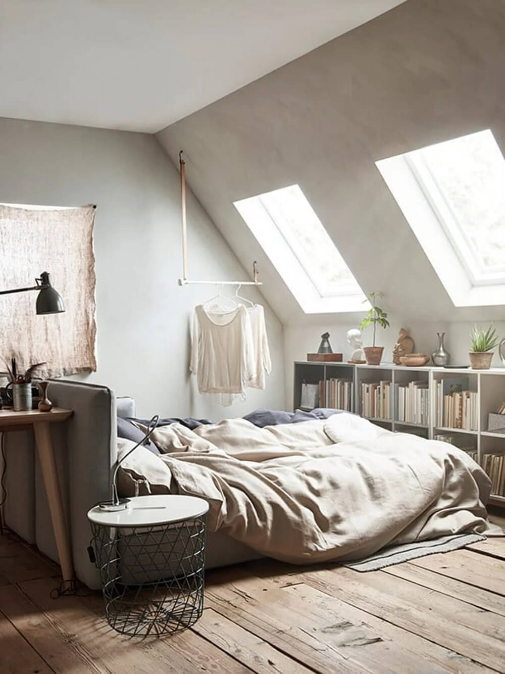 ikea-bedroom-bed-center-room-bookshelves-under-slanted-ceiling-nordroom