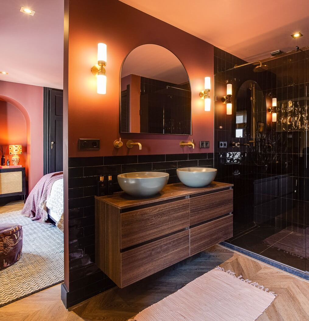 bathroom-black-shower-tiles-pink-walls-wooden-vanity-nordroom