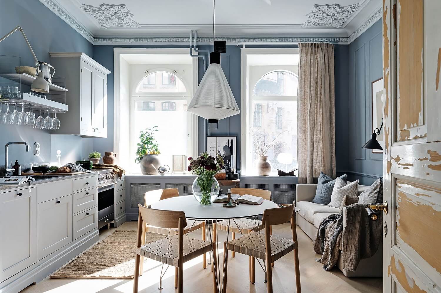 blue-studio-apartment-light-gray-kitchen-raw-wooden-doors-nordroom