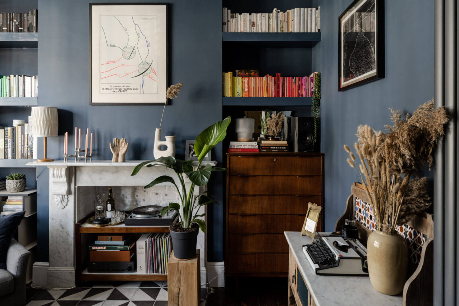 built-in-bookshelves-fireplace-dark-blue-living-room-nordroom