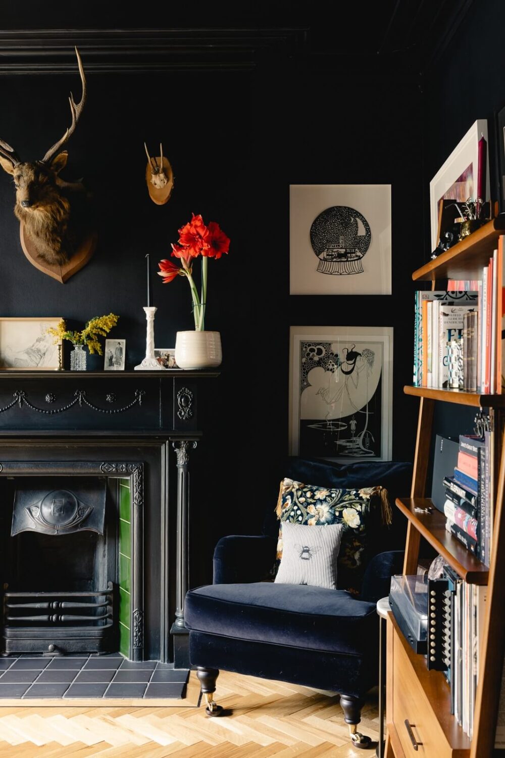 moody-blue-dining-room-velvet-blue-chair-black-fireplace-nordroom