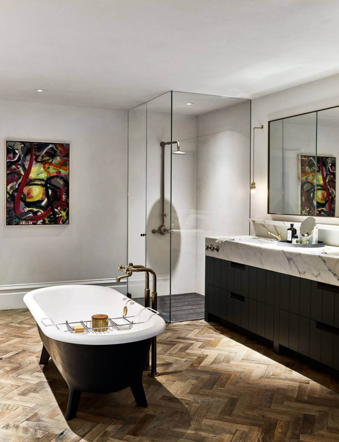 simple-luxurious-bathroom-wood-floor-marble-freestanding-bathtub-black-accents-nordroom
