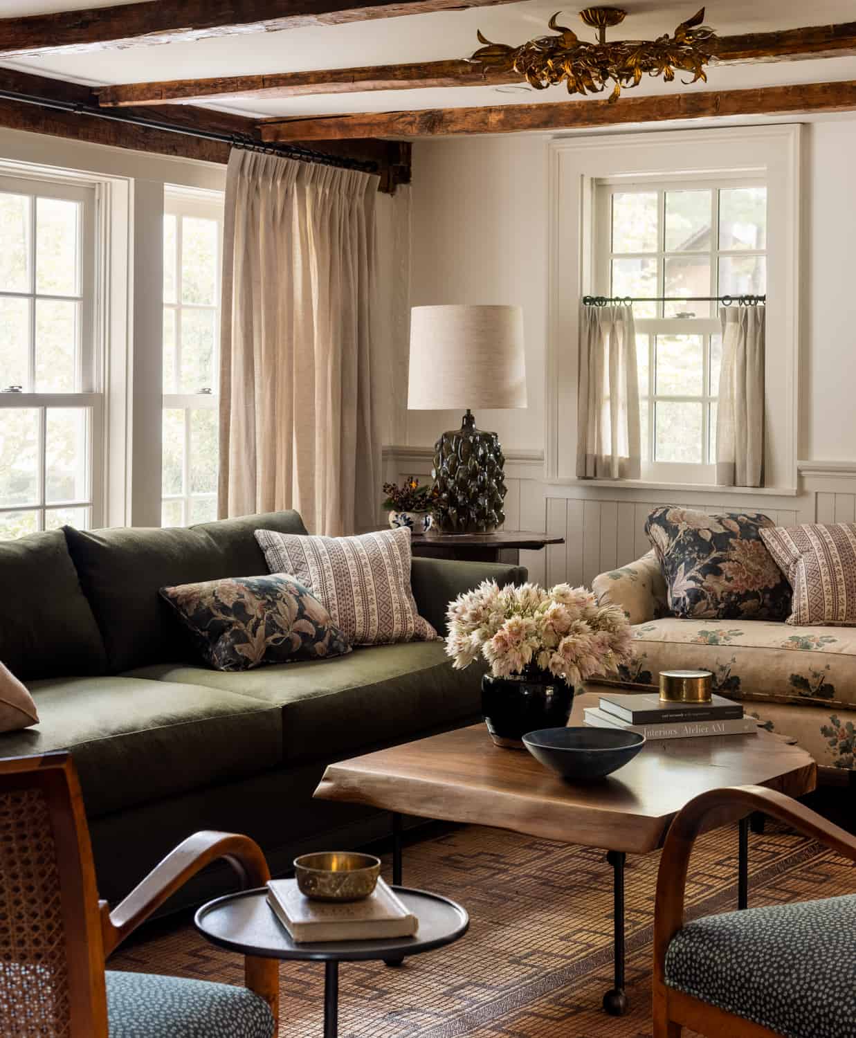 Heidi-Caillier-Design-Hudson-Valley-farmhouse-living-room-pattern-texiles-old-beams-Nordroom