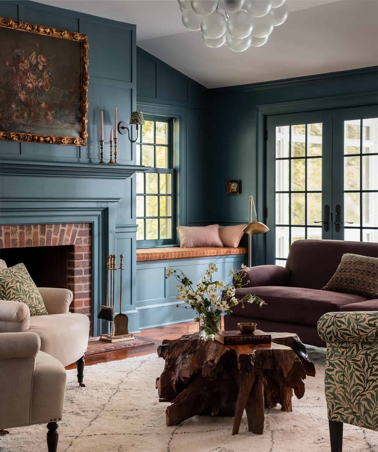 Heidi-Caillier-Design-Hudson-Valley-house-dark-blue-family-room-william-morris-sofa-vintage-floral-painting-apparatus-light-Nordroom