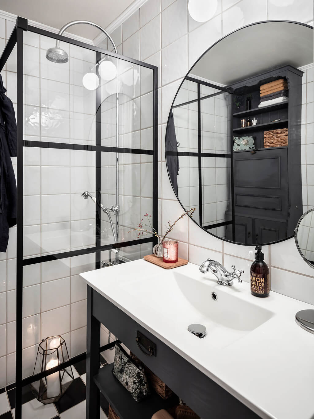 bathroom-dark-blue-vanity-round-mirror-nordroom