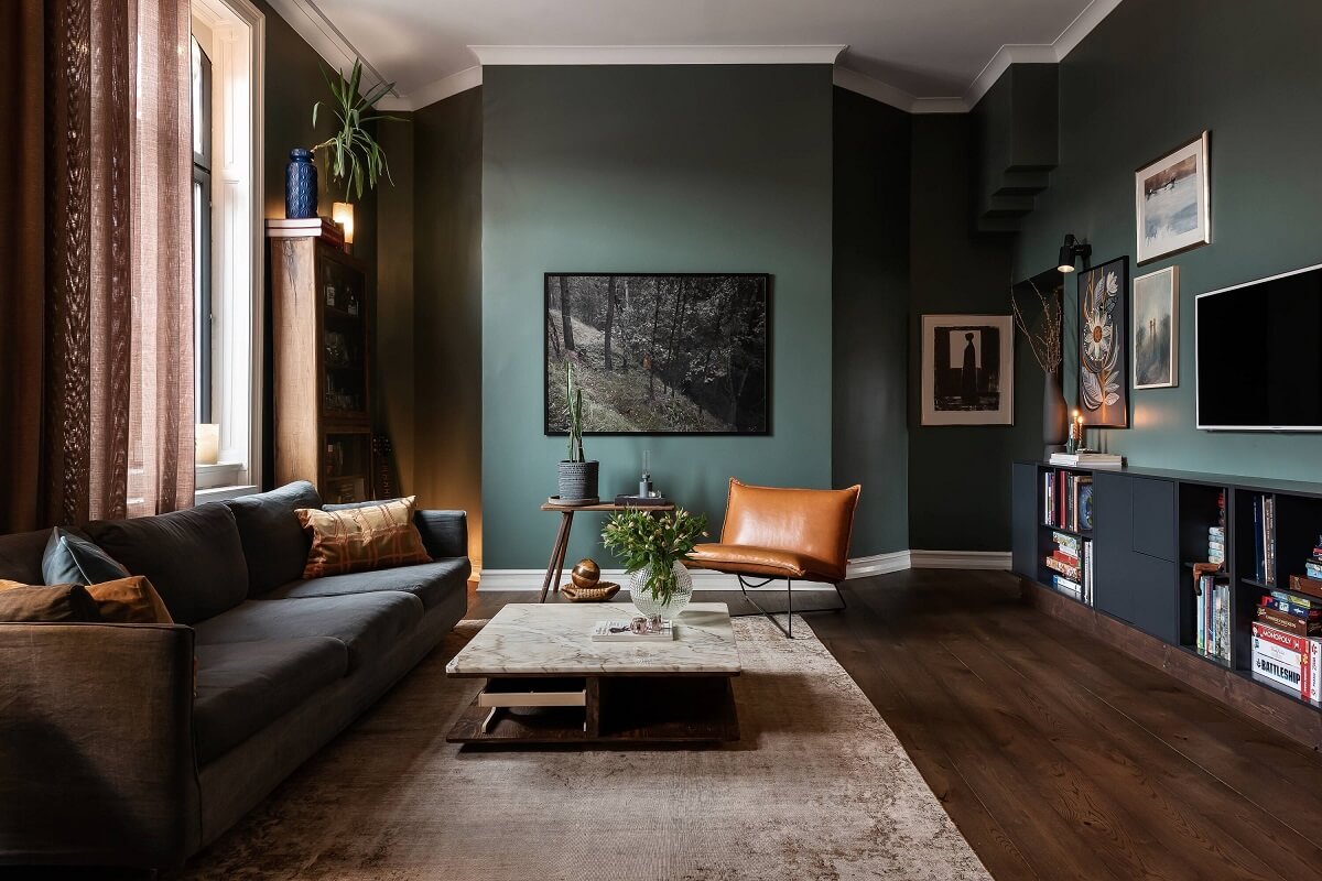 green-living-room-wooden-floor-moody-home-nordroom