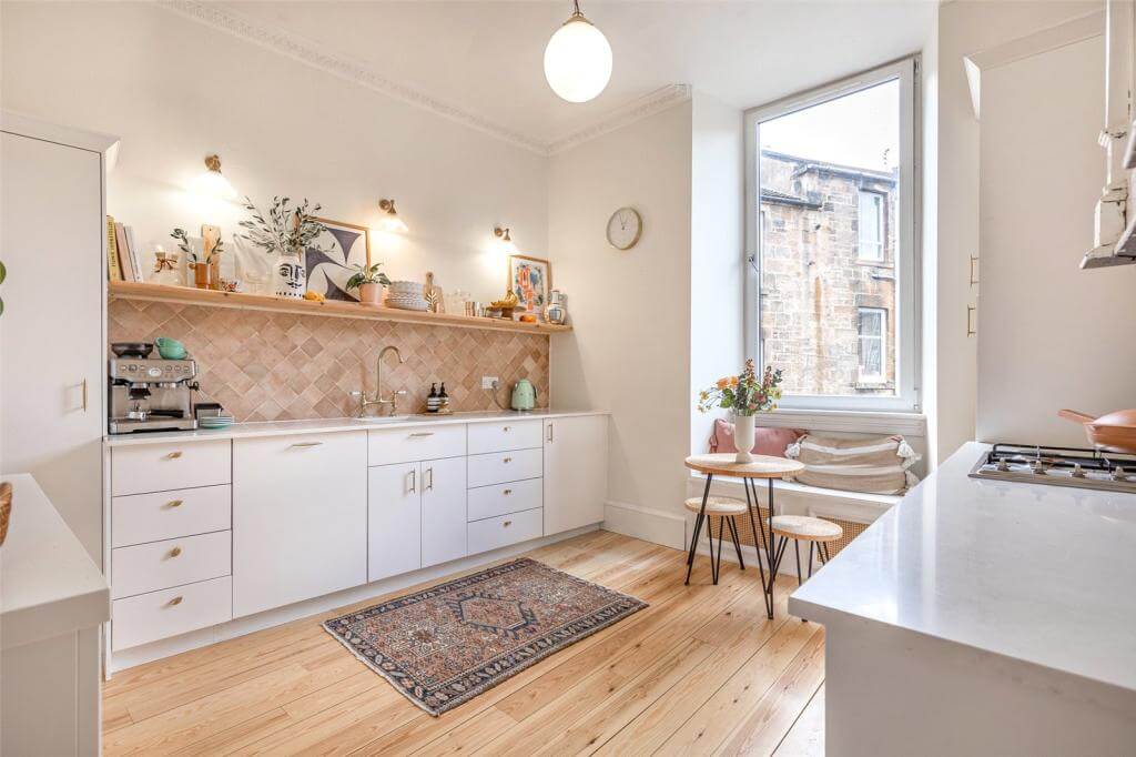 kitchen-wooden-floor-white-kitchen-cabinets-window-seat-kate-spiers-glasgow-apartment-nordroom