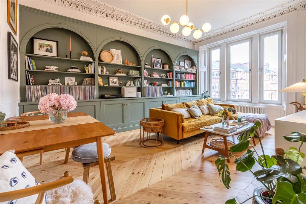 living-room-custom-made-green-bookshelves-arches-wooden-floor-nordroom