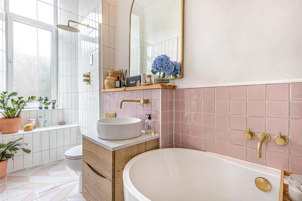 narrow-bathroom-freestanding-bath-shower-arched-mirror-pink-tiles-nordroom