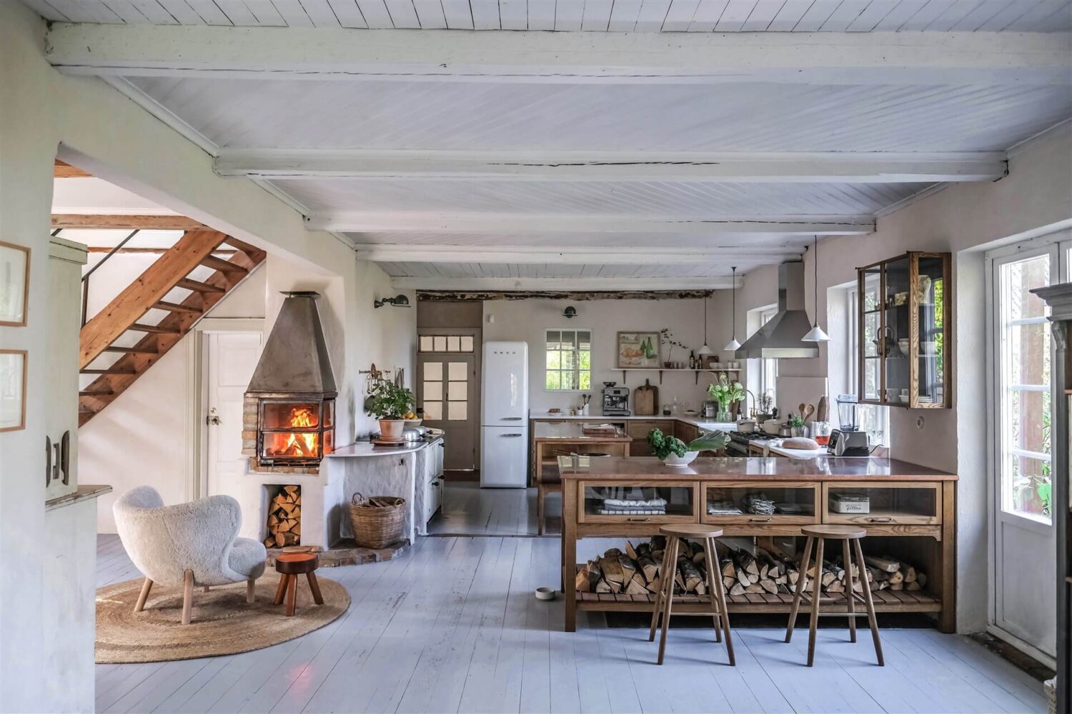 open-plan-kitchen-devol-haberdasher-sitting-room-fireplace-countryside-home-our-food-stories-nordroom