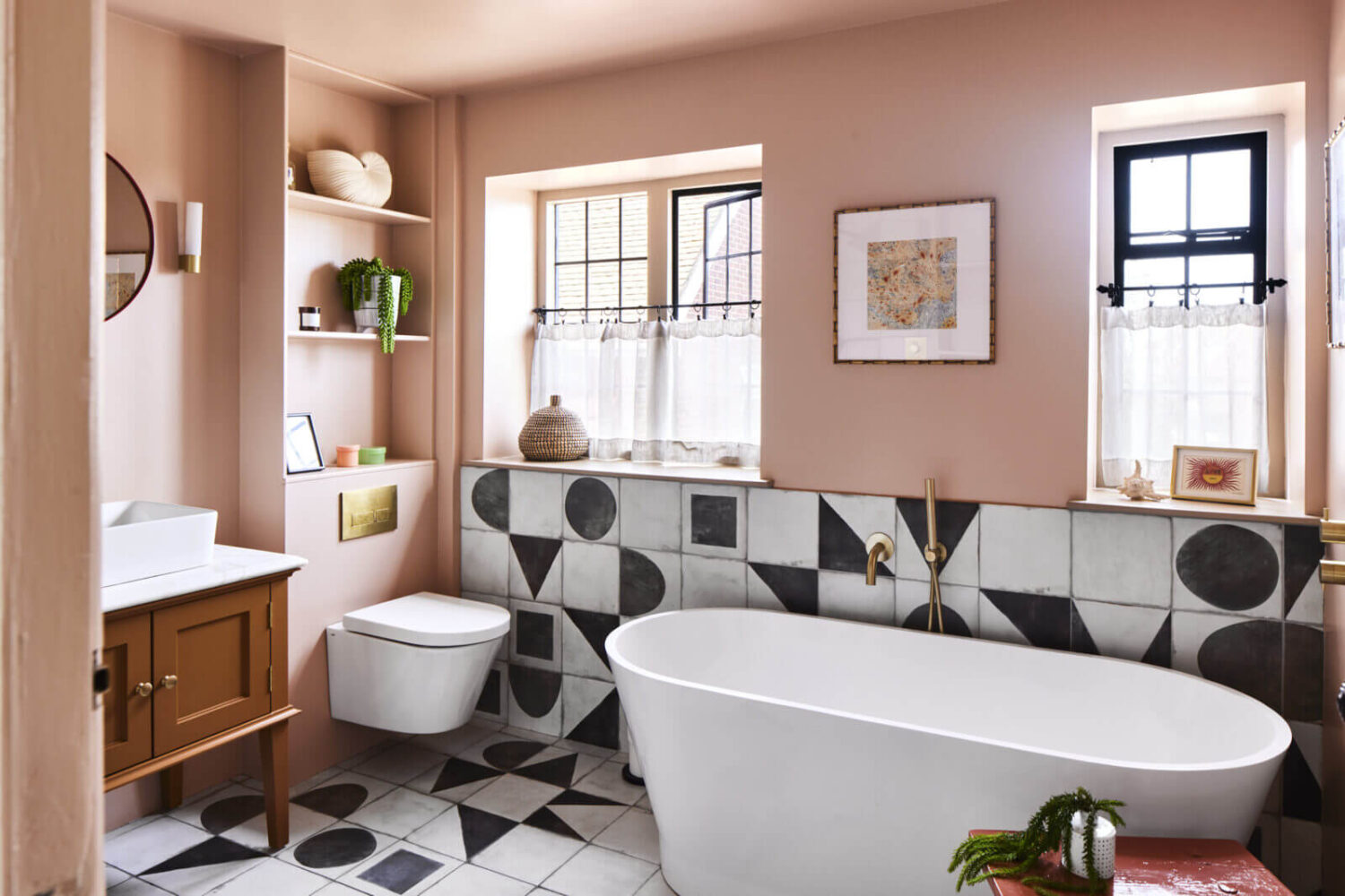bathroom-pink-walls-freestanding-bath-black-white-geometric-tiles-nordroom