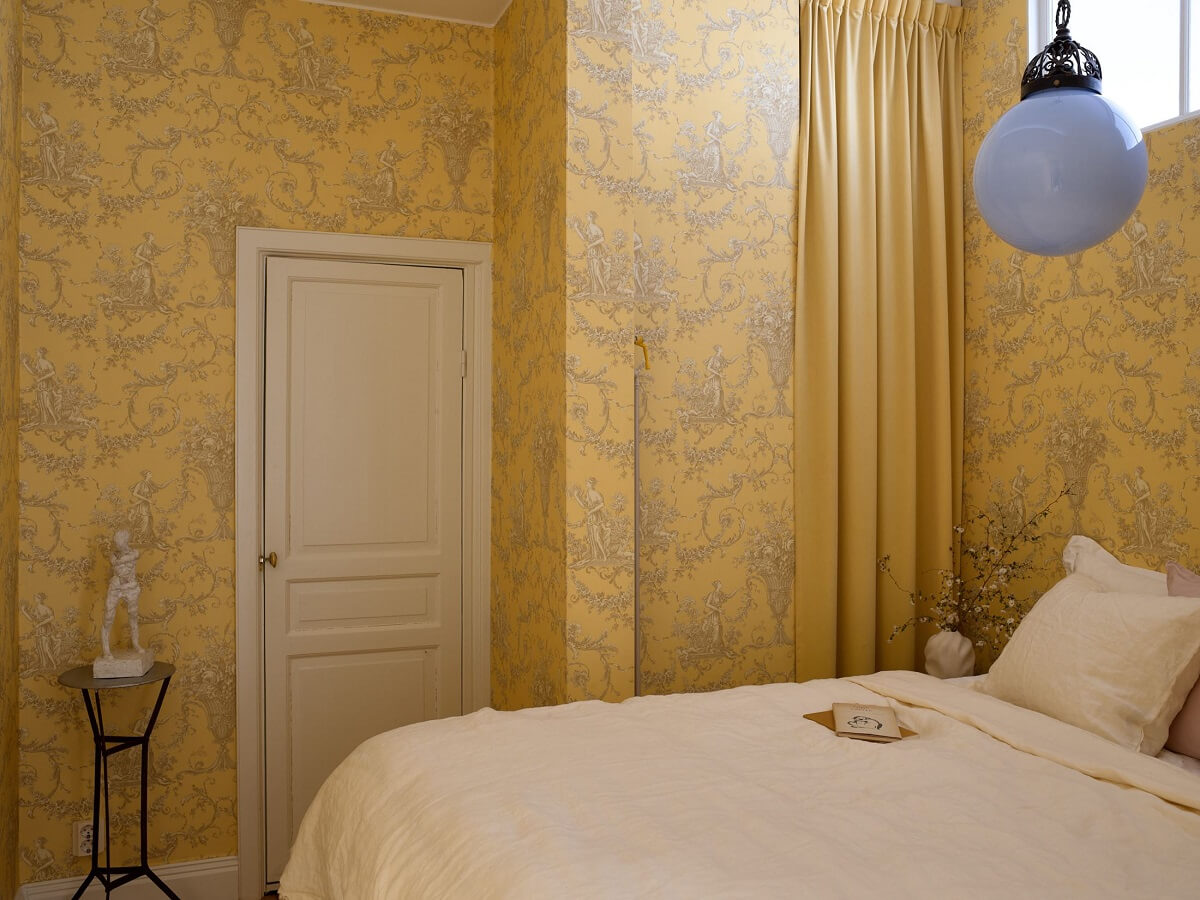 A Bedroom with Yellow French Wallpaper in a Small Scandi Home - The Nordroom