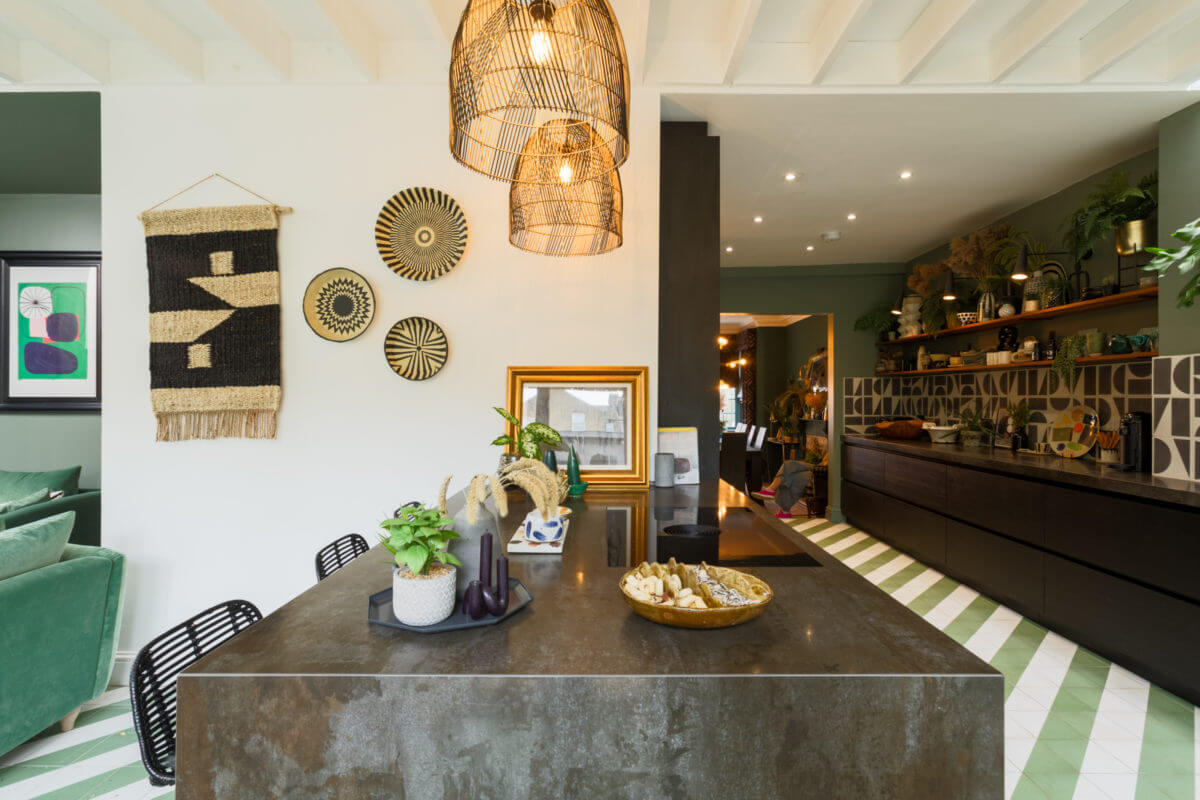 black-breakfast-island-kitchen-green-walls-open-shelves-nordroom