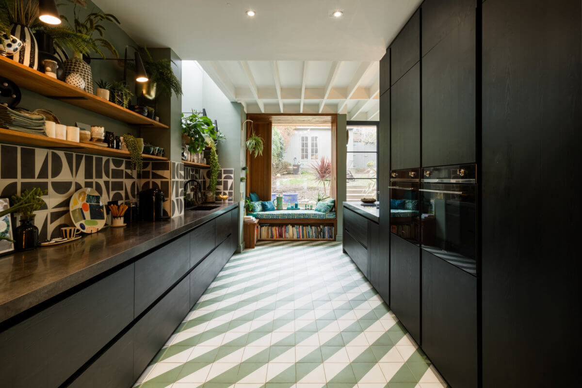 black-kitchen-green-walls-diagonal-floor-tiles-reading-nook-nordroom